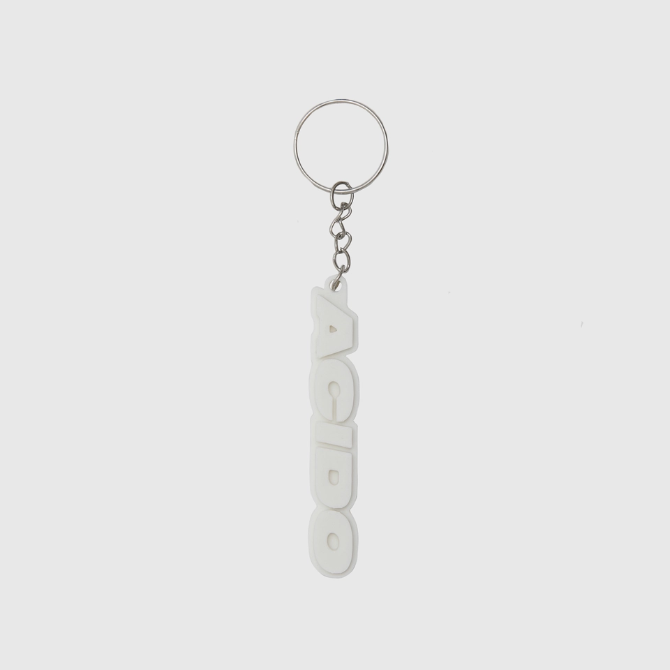 Portachiavi bianco con il logo 'ACIDO' in rilievo, design verticale.