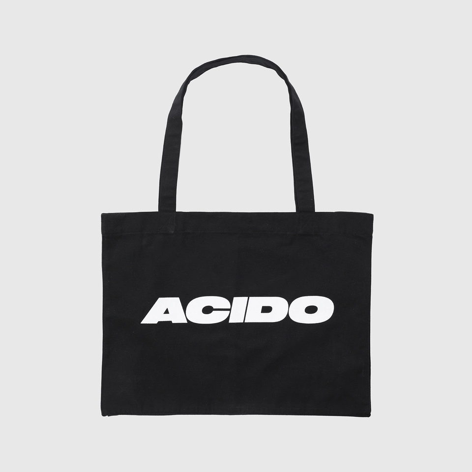 Totebag nera in tessuto con il logo 'ACIDO' stampato in bianco sulla parte frontale.